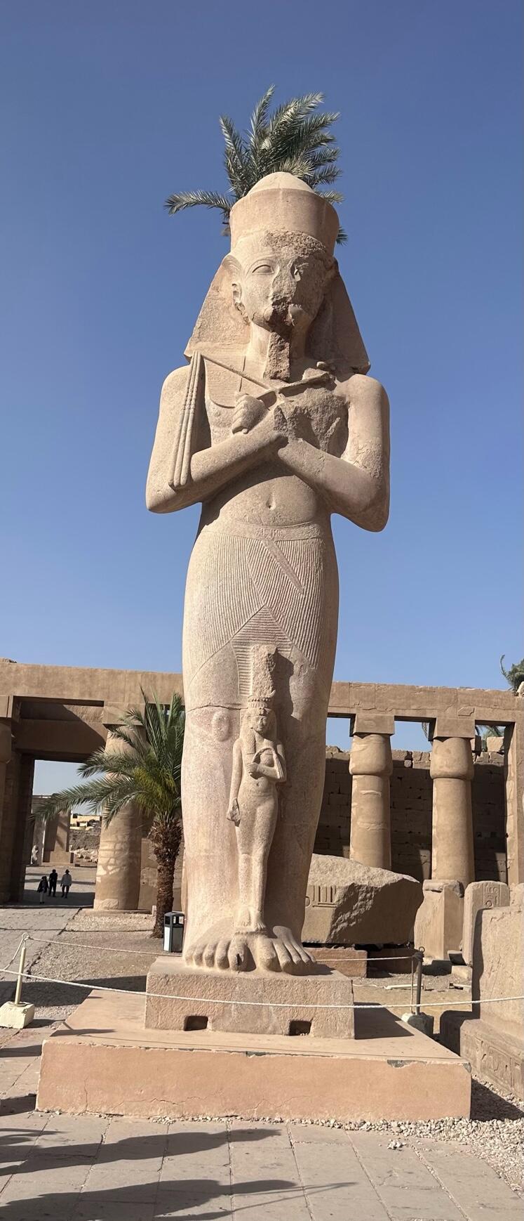 Ramses II with a tiny Nefertari between his legs - at Karnak